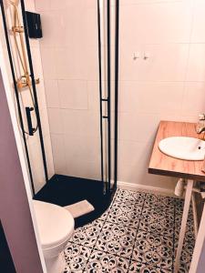 a bathroom with a shower and a toilet and a sink at Supreme Apartment in the City Center in Kraków