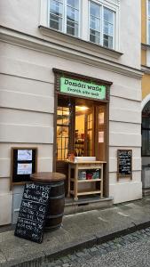 a donut shop with a sign in front of it at Dům Pod Věží in Mikulov