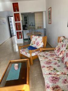 a living room with a couch and a coffee table at Apartamento Marina in Puerto del Carmen