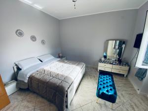a bedroom with a large bed and a drink machine at B&B 1898 - Villa Colonna in Altamura