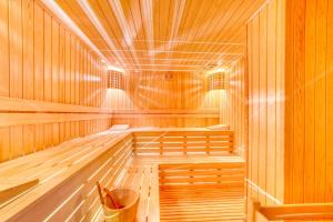 a sauna with wooden walls and a wooden ceiling at Aria Riva Apart Hotel in Alanya