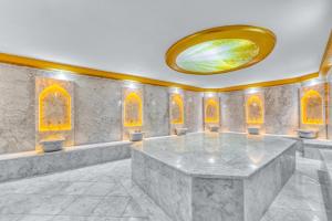 a large room with a large marble table at Aria Riva Apart Hotel in Alanya