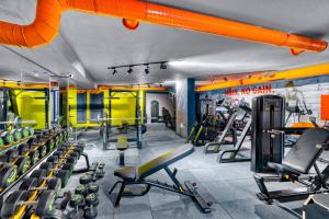 a gym with lots of treadmills and machines at Aria Riva Apart Hotel in Alanya