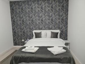 מיטה או מיטות בחדר ב-Global Residence Lake View