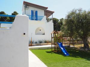 a playground in the yard of a house at Bianco e Azzuro in Vouliagmeni Lake