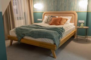 Ένα ή περισσότερα κρεβάτια σε δωμάτιο στο Willa Zalesie