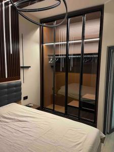 a bedroom with a bed and a large mirror at ATH Modern Homes - Luxury Apartment in the City Center in Iaşi