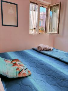 Giường trong phòng chung tại I 23 PASSI Marina di Minturno