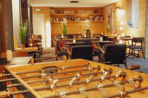 a room filled with lots of musical instruments on a table at Hôtel Mont Thabor Serre Chevalier in La Salle Les Alpes