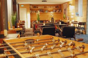 a room filled with lots of musical instruments on a table at Hôtel Mont Thabor Serre Chevalier in La Salle-les-Alpes