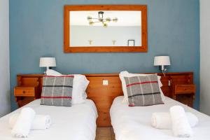 Postel nebo postele na pokoji v ubytování Hôtel Mont Thabor Serre Chevalier
