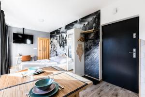 Łóżko lub łóżka w pokoju w obiekcie Apartament Sova