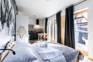 Łóżko lub łóżka w pokoju w obiekcie Apartament Sova