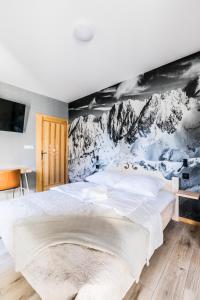 Łóżko lub łóżka w pokoju w obiekcie Apartament Sova