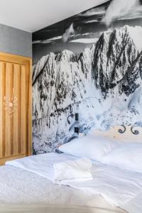 Łóżko lub łóżka w pokoju w obiekcie Apartament Sova