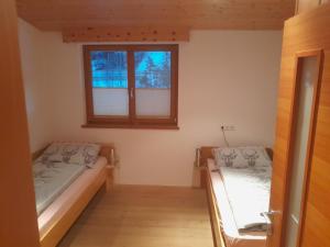 Postel nebo postele na pokoji v ubytování Haus Hotz Apart Talblick