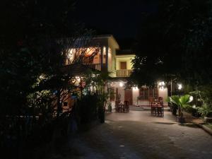a house at night with tables and chairs at Lily Pad Boutique Hotel in Siem Reap