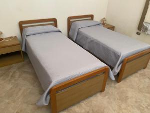 Postel nebo postele na pokoji v ubytování Baràka - Bungalow sulla spiaggia