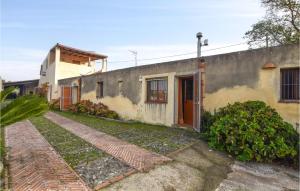 a house with a brick walkway in front of it at Gorgeous Home In Santa Lucia Del Mela in Santa Lucia del Mela