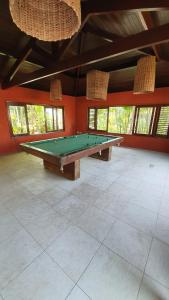 a large room with a pool table in it at Villas do Pratagy Maceió in Maceió