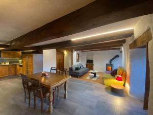 a living room with a table and a couch at La Majorie de Nendaz in Nendaz