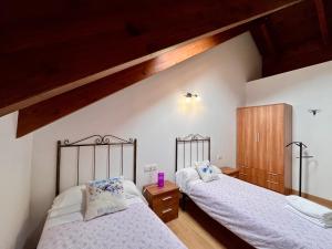 A bed or beds in a room at BPIRINEOS-Ardonés