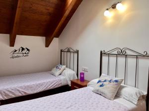 A bed or beds in a room at BPIRINEOS-Ardonés