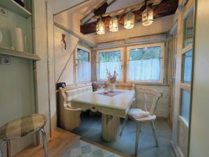 a tiny house dining room with a table and chairs at Haus Dorothee in Sautens