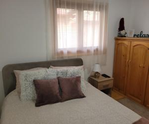Llit o llits en una habitació de Apartmani D&S