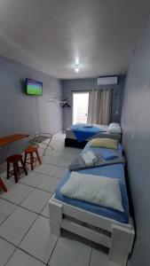 Cama o camas de una habitación en ZZZ BRUNO KLEMTZ - Residencial Recanto dos Pássaros Estúdio até 4 pessoas com ar Split wifi coz vaga