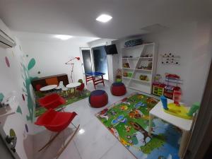 a childs room with a table and chairs at Bellagio Tower in Punta del Este