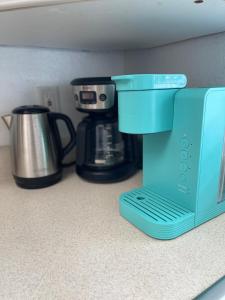 a blue coffee maker sitting on top of a counter at Bright and Beachy 2Bed 1Bath Home - Unit 210 in Cocoa Beach