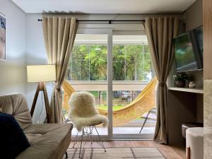 TV a/nebo společenská místnost v ubytování Delle Alpi 2 dorm ao lado Roda Gigante by Achei