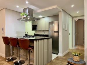 Kuchyň nebo kuchyňský kout v ubytování Delle Alpi 2 dorm ao lado Roda Gigante by Achei