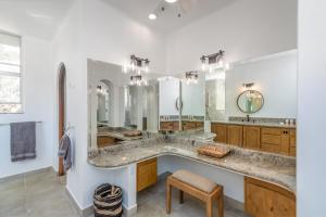 a bathroom with a large sink and a large mirror at The one and only Pedregal Hollywood House in Cabo San Lucas