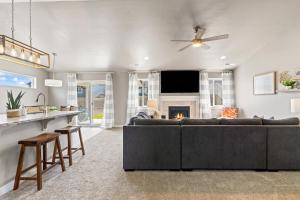a living room with a couch and a fireplace at Brand New Valley View Caldwell home in Caldwell
