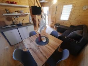 an overhead view of a living room with a table and chairs at Brvnare Borove iglice in Vinci