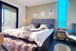 a bedroom with a bed with a laptop on it at Casa NovPool perfect for families in Nov