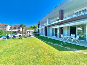 a view of a house with a yard at EllinFos ApartHotel in Hanioti