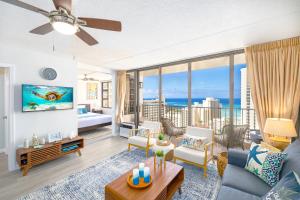 a living room with a view of the ocean at Waikiki Upscale 1 BR - Ocean Views - Parking in Honolulu