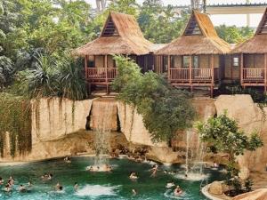 a pool at a resort with people in the water at Apartment SL Lounge, Luebben in Lübben