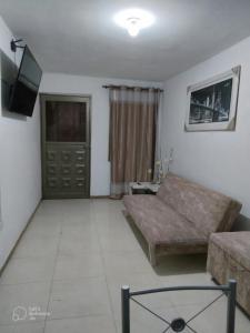 Μια τηλεόραση ή/και κέντρο ψυχαγωγίας στο Apartamentos The Harbor Cali 102