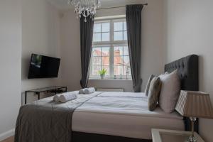 Łóżko lub łóżka w pokoju w obiekcie Olives Marina Apartment Gdańsk