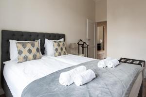 Łóżko lub łóżka w pokoju w obiekcie Olives Marina Apartment Gdańsk