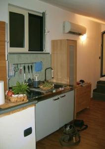 a kitchen with a sink and a counter top at Casa Iolanda in Sorrento