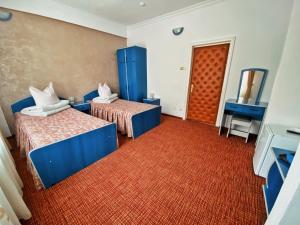 Tempat tidur dalam kamar di Hotel Belvedere