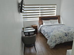 TinyApartments - estudio pleno centro Concepción客房内的一张或多张床位