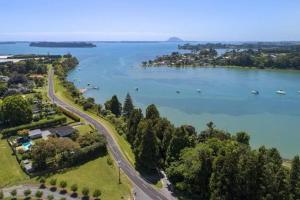 an aerial view of a lake with boats in the water at Kotuku Cottage in Tauranga