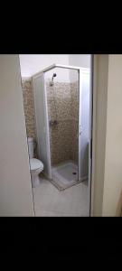a bathroom with a shower and a toilet at Appartement meublé près du grand souk Elhad in Agadir