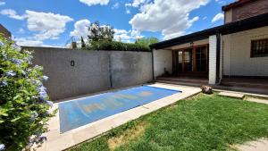 a swimming pool in the yard of a house at Casa Simona in San Rafael
